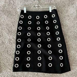 Black pencil skirt with metal rings on front